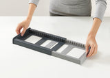 Fácil montaje del soporte extensible para tapas de ollas